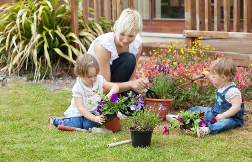 Hounslow soft landscaping service showing planted borders and lawn preparation